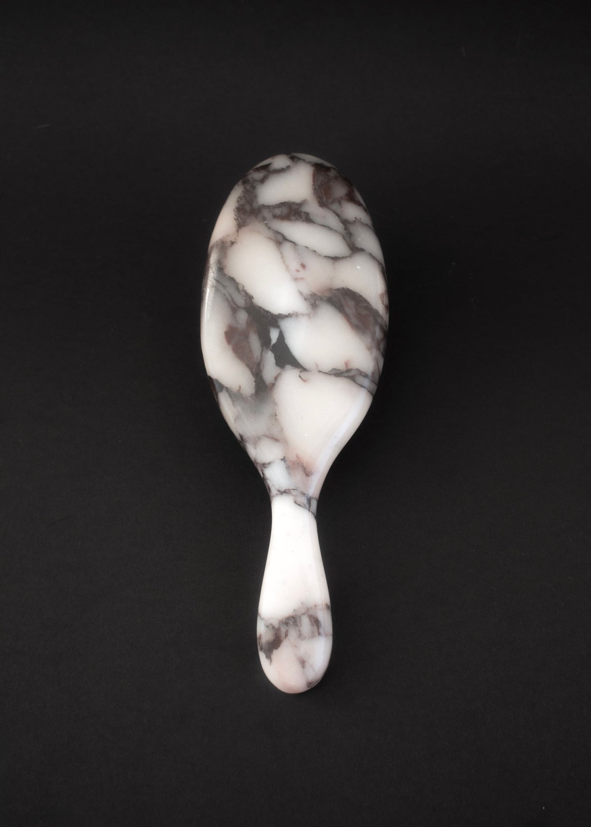 The Marble Hairbrush from above, showing the Calacatta Viola veining